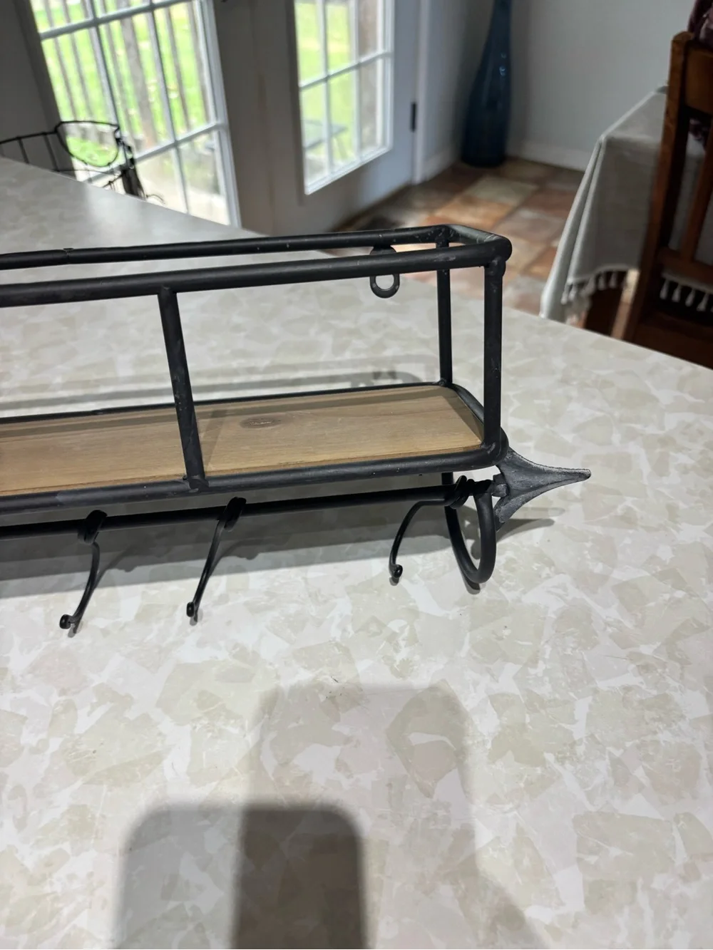 Rustic Black Metal Wall Shelf with Hooks and Wood Accent